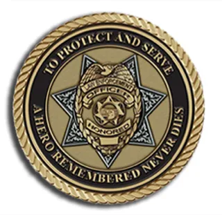 Police service bronze emblem reading to protect and serve.